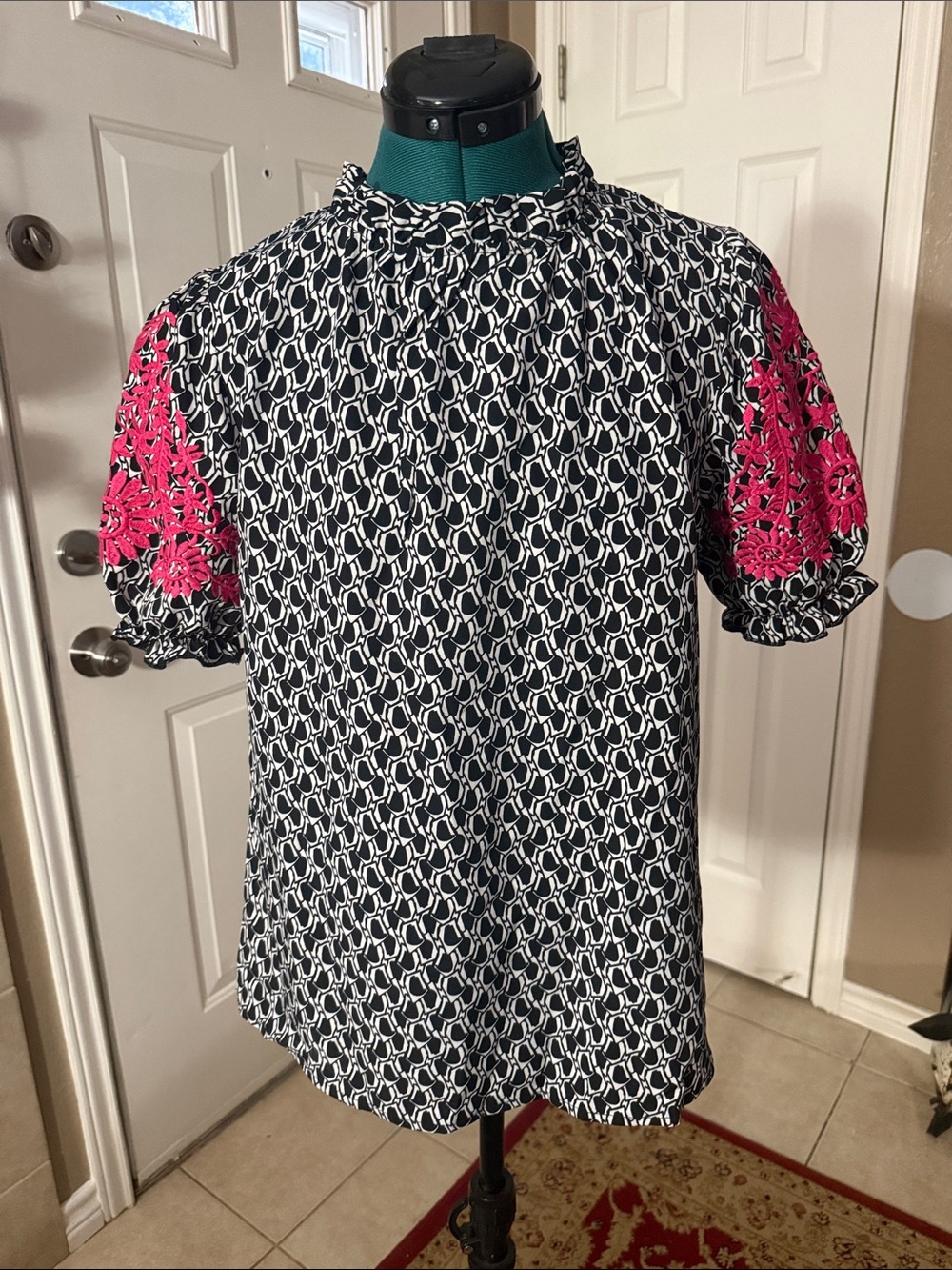 Black and white blouse with pink embroidery